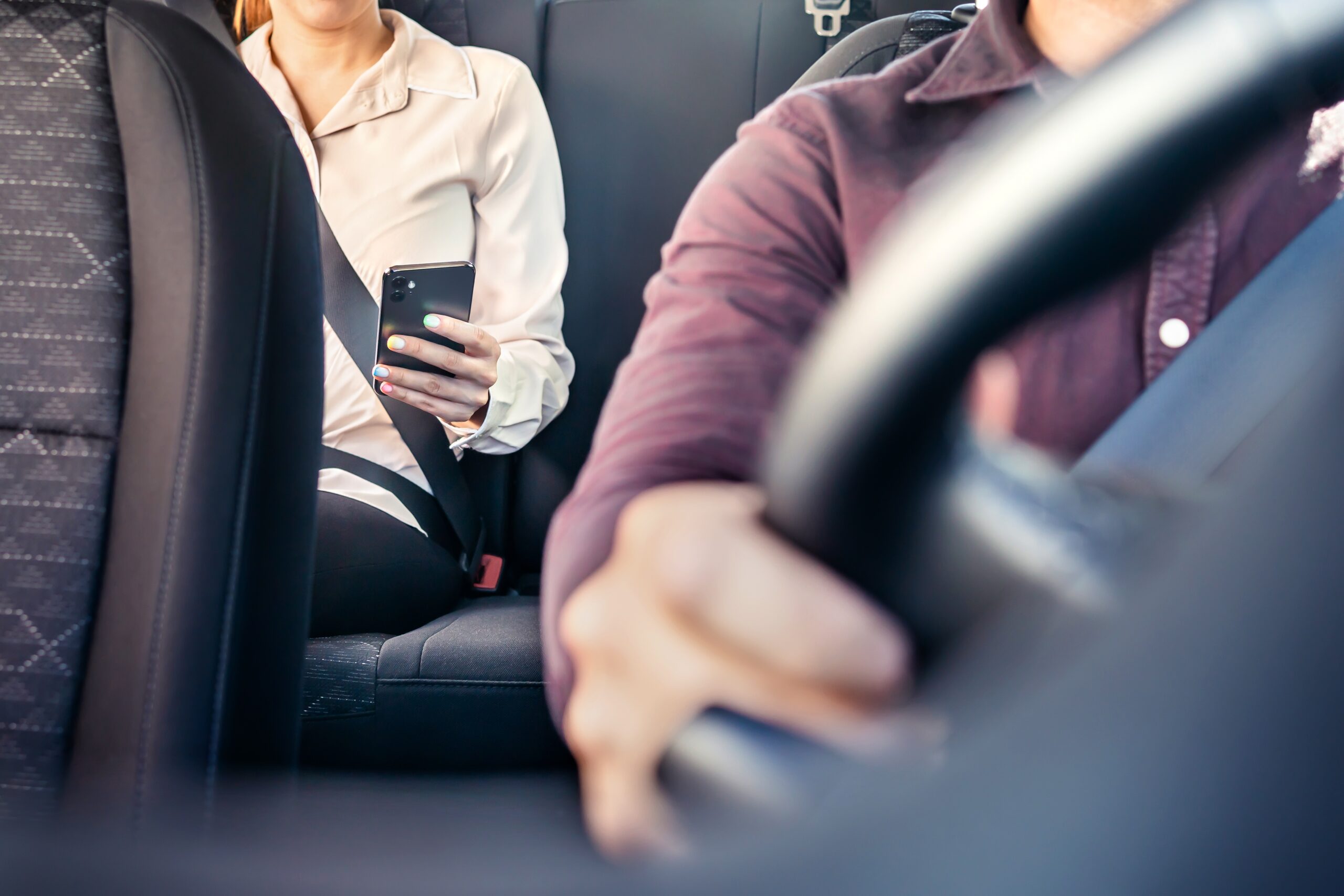 image of a rideshare driver with a passenger in the back to represent Alejandro Betancourt's company Auro Travel