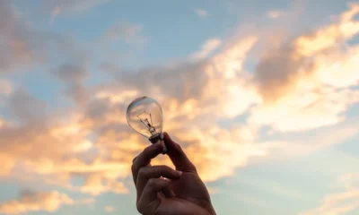 Hand with a light bulb