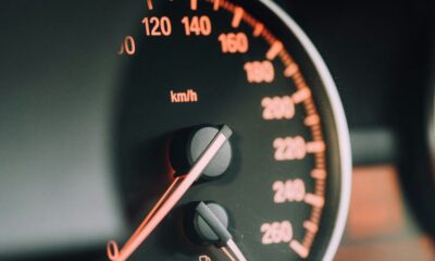 closeup photo of black analog speedometer