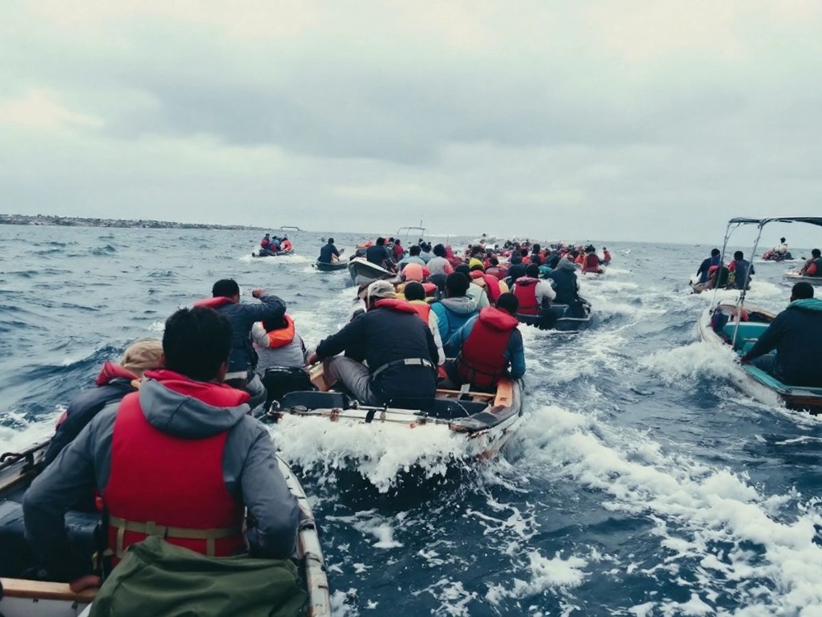 Crowded small boat channel with multiple vessels in motion.