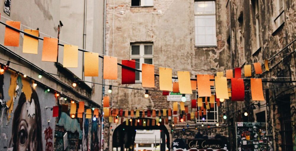 photo of buntings hanged near graffiti artworks