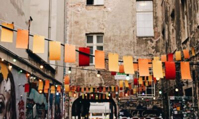 photo of buntings hanged near graffiti artworks