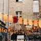 photo of buntings hanged near graffiti artworks