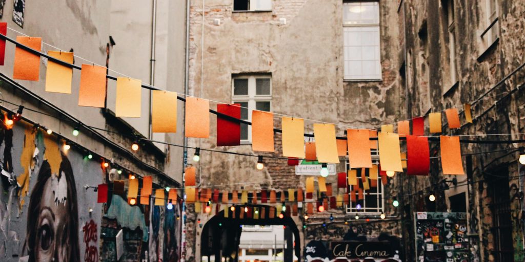 photo of buntings hanged near graffiti artworks