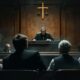 Courtroom scene with a judge and the accused.