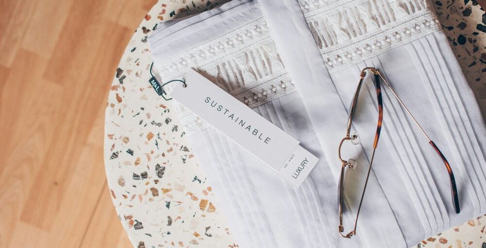 silver framed eyeglasses on white and blue floral textile