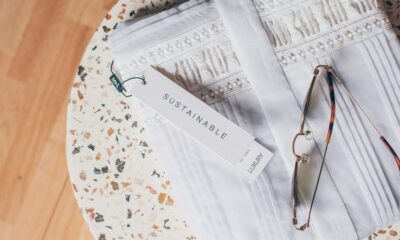 silver framed eyeglasses on white and blue floral textile