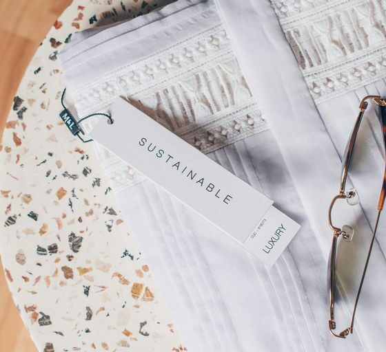 silver framed eyeglasses on white and blue floral textile