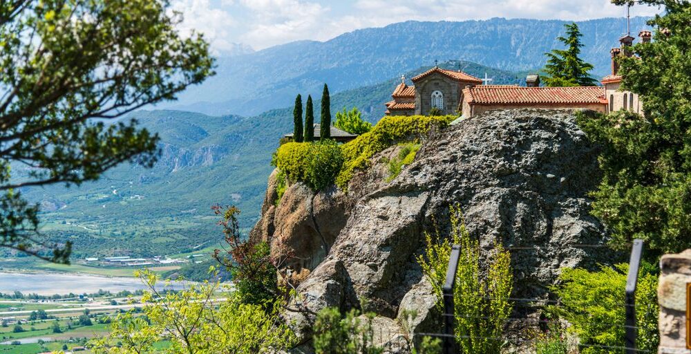 a house on top of a mountain overlooking a valley