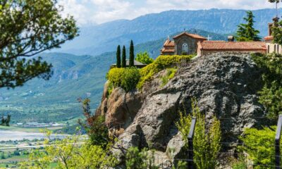 a house on top of a mountain overlooking a valley