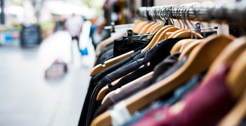 selective focus photography of hanged clothes