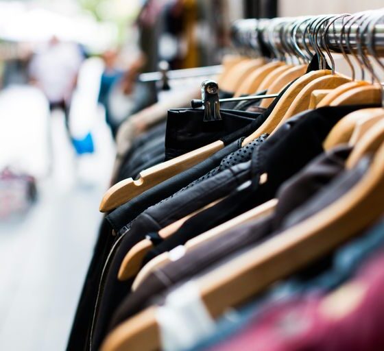 selective focus photography of hanged clothes