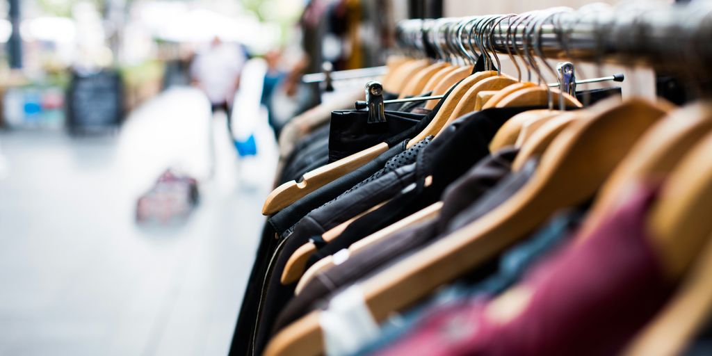 selective focus photography of hanged clothes