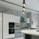 a modern kitchen with marble counter tops and stainless steel appliances