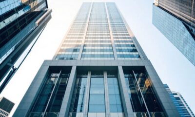 Modern bank building in a bustling cityscape.