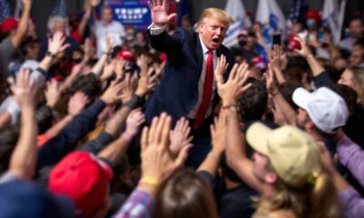 Divided crowd at a Trump campaign rally.