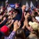 Divided crowd at a Trump campaign rally.