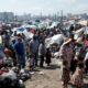 Displaced Haitian families in a crowded tent city.