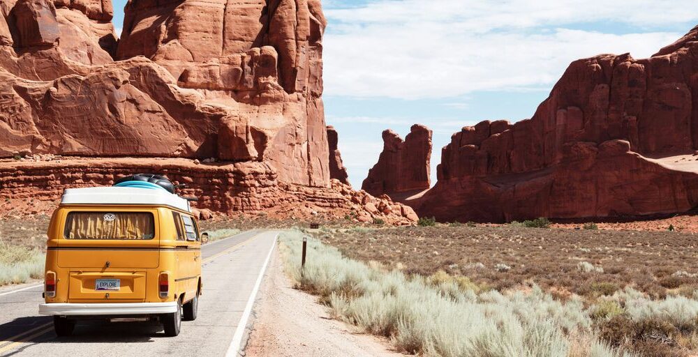 yellow Volkswagen van on road