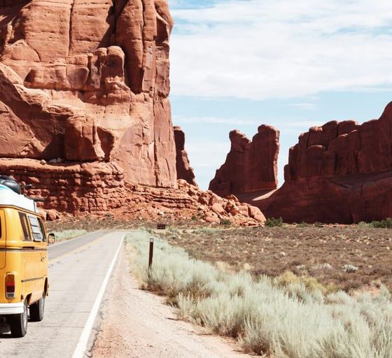 yellow Volkswagen van on road