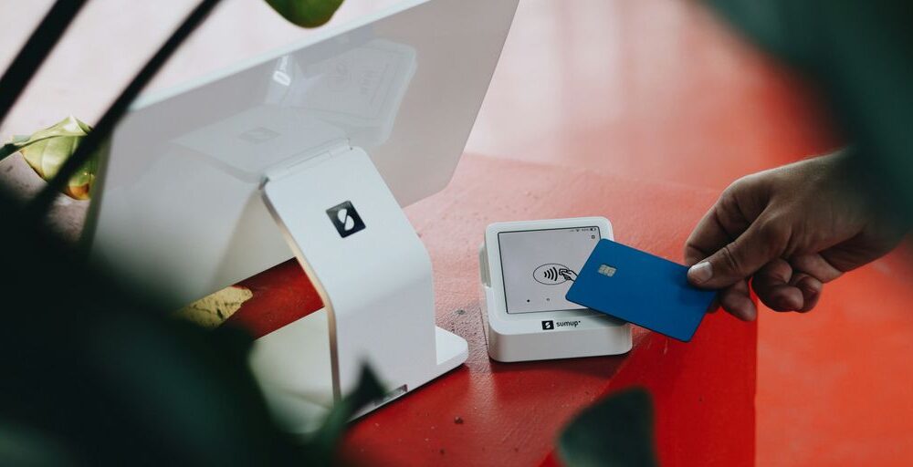 A person opening a box on a table