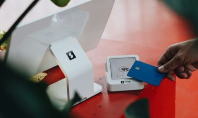 A person opening a box on a table