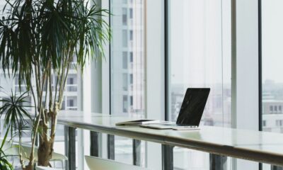 turned off laptop computer on top of brown wooden table