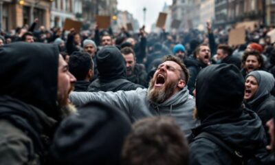 Protesters clashing in the streets during anti-immigration rally.