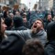 Protesters clashing in the streets during anti-immigration rally.