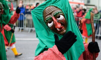 woman in green hijab and red long sleeve dress