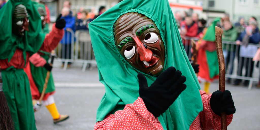 woman in green hijab and red long sleeve dress