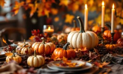 Thanksgiving table with pumpkins and autumn leaves.