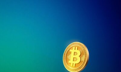 A glowing Bitcoin coin in a blue-green background.