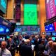 Busy stock market floor with traders during earnings surge.