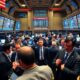 Traders on a busy stock exchange floor.