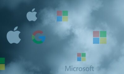 Tech company logos amidst dark clouds of uncertainty.