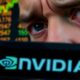 Concerned investor with Nvidia logo in focus.