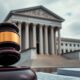 Federal courthouse with gavel, symbolizing legal challenges.