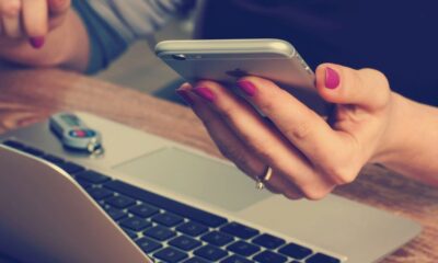 woman holding silver iPhone 6