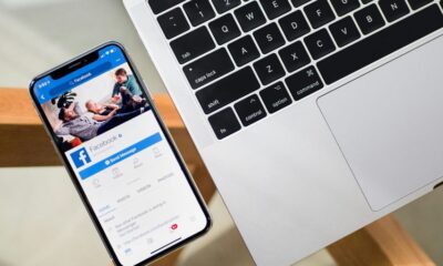 iPhone X beside MacBook