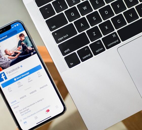 iPhone X beside MacBook