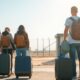 Group of immigrants with luggage at a border crossing.