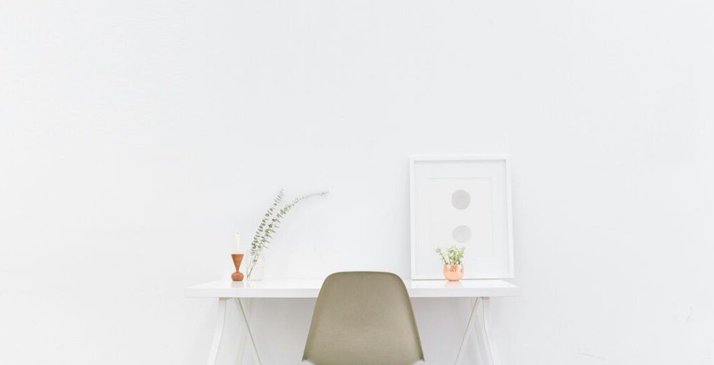 white wooden table near brown chair