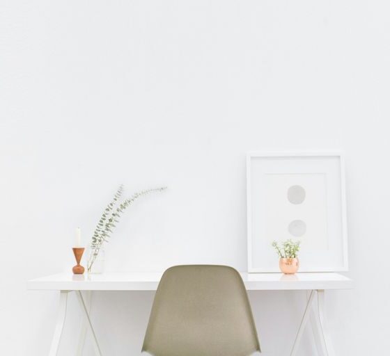 white wooden table near brown chair