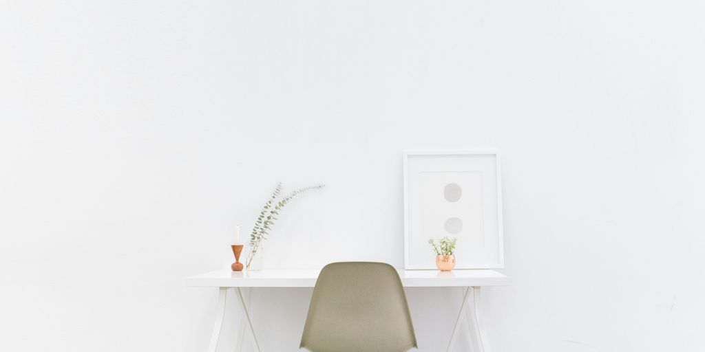 white wooden table near brown chair