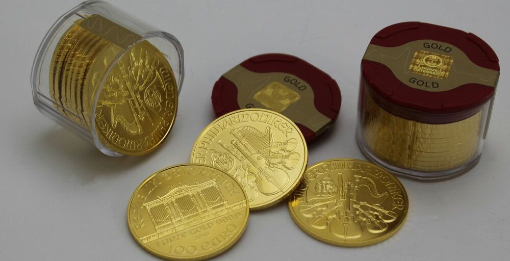 gold round coins on white surface