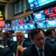 Traders reacting to stock market dip amid tariff concerns.