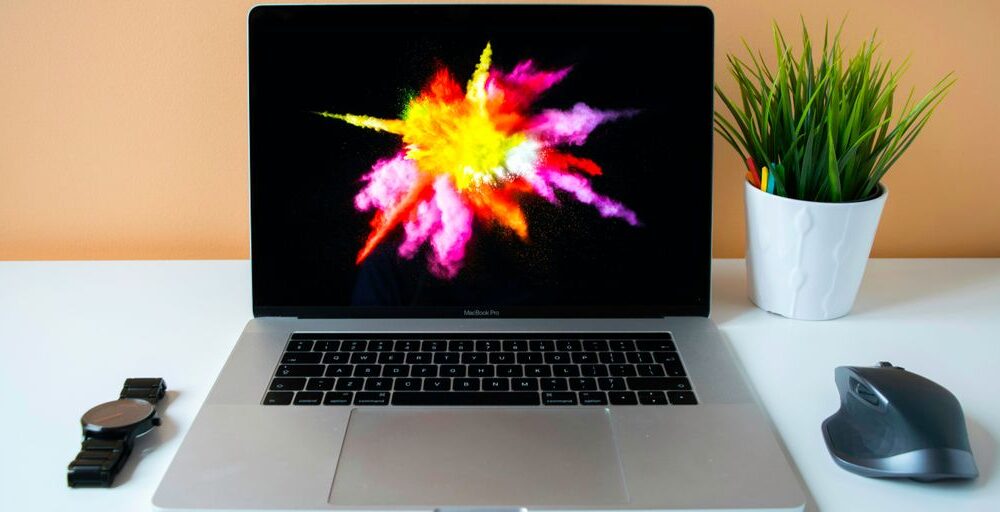 MacBook Pro showing purple illustration
