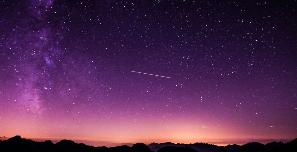 silhouette photo of mountain during night time