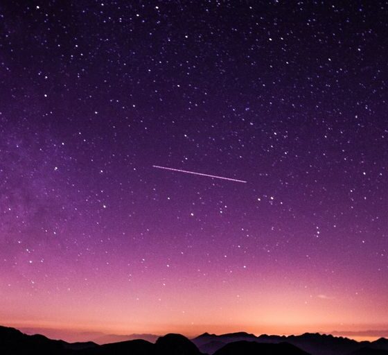 silhouette photo of mountain during night time